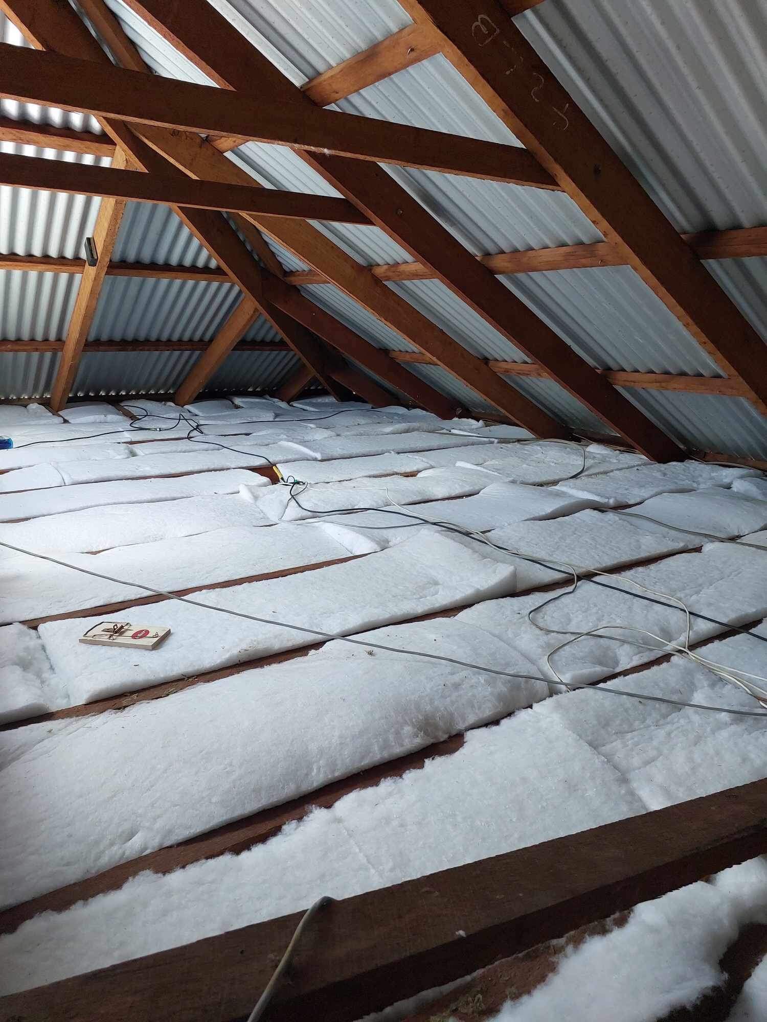 a roof with snow on the ground