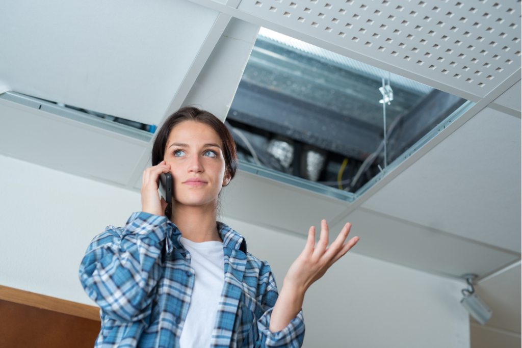 Frustrated homeowner looking at a poorly insulated ceiling | Brisbane Ceiling Insulation