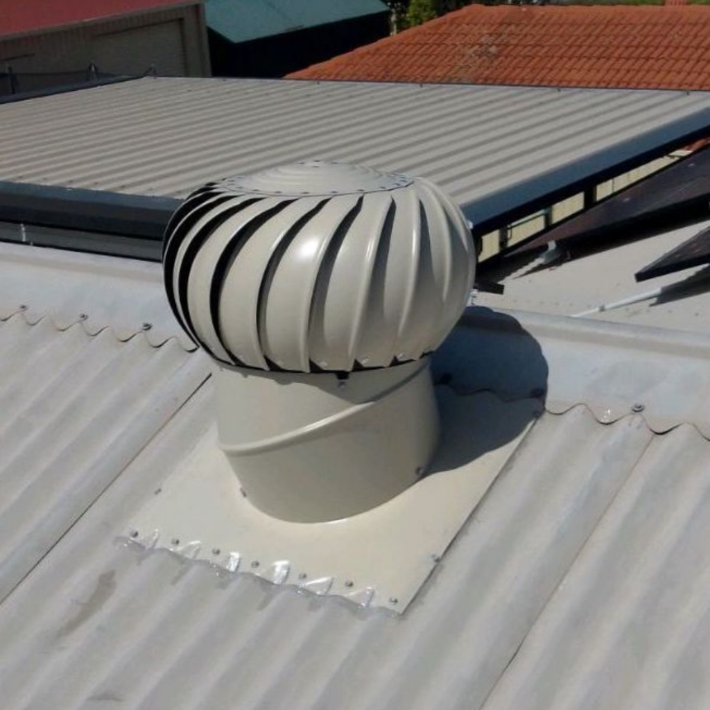 Whirlybird roof ventilator reducing heat and moisture buildup in a home’s roof cavity